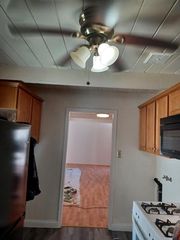 Galley kitchen with washer/dryer on each side