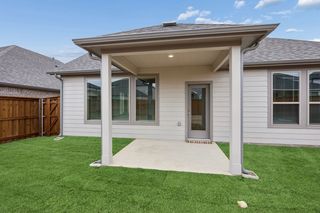 Covered Patio in the Stanley II home plan by Trophy Signature Homes - REPRESENTATIVE PHOTO
