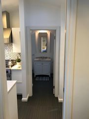 The view from the kitchen to the bathroom vanity