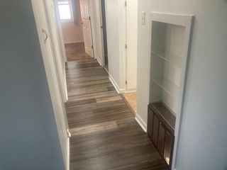 View from the Living Room down the hallway leading to the bathroom and the 3 BD's...