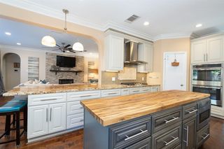 This kitchen is sure to be a chef's dream with all this prep space as well as storage space! Tons of crisp white and two-toned cabinets with nickel drawers pulls surely make a statement along with stainless steel appliances that were installed in 201