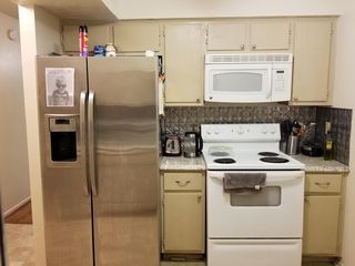 Kitchen refrigerator and oven