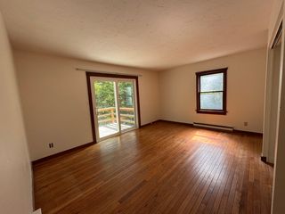 Main bedroom with new sliding glass door to the deck.