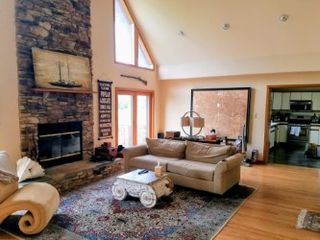 main living room with wood burning fireplace