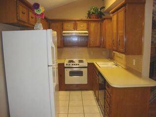 Kitchen has new countertops & new black range