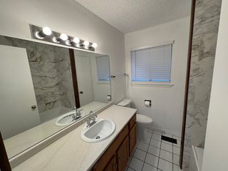 Updated Full bath with new countertops, sink, and fixtures!