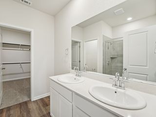 Live in luxury in the primary bathroom.