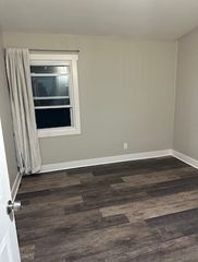 Bedroom 3 located off the living space at the opposite end of the house from the bathroom. This room also features in-floor radiant heat with a dedicated thermostat.