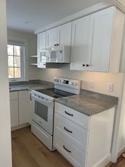view of kitchen, right side. Lots of counter space and storage for a small kitchen.