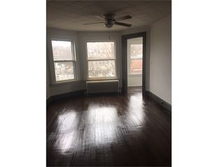 Large living room with lots of natural light