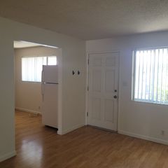 Living Room, Window, exterior door, and portion of the kitchen
