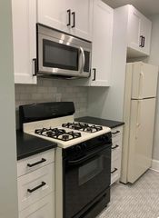 New cabinets, tile, backsplash, microwave