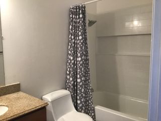 Close up of bathtub and shower