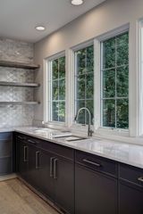 Open shelves, deep sink, forest backdrop