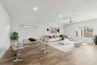 Living and Dining Rooms in the Oscar home plan by Trophy Signature Homes - REPRESENTATIVE PHOTO
