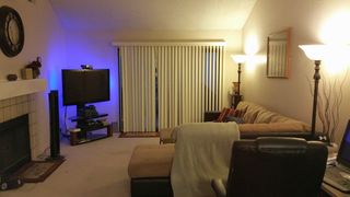 Living Room has door to patio overlooking brook and fountain