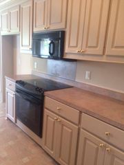 Stove and lots of cabinets