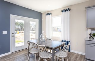 Kitchen Dining Area. Photo of Model Home.