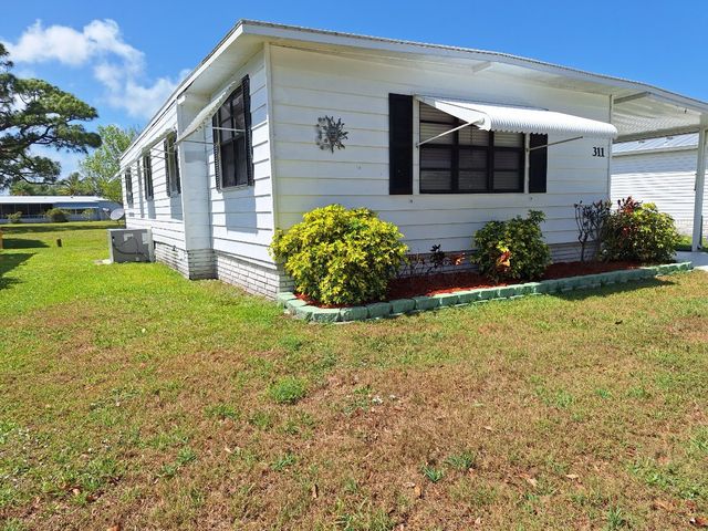 311 Egret Cir, Barefoot Bay, FL 32976